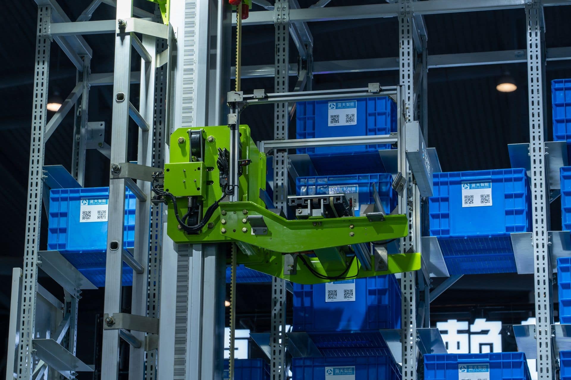 Automated storage shuttle handling blue totes in a high-bay rack