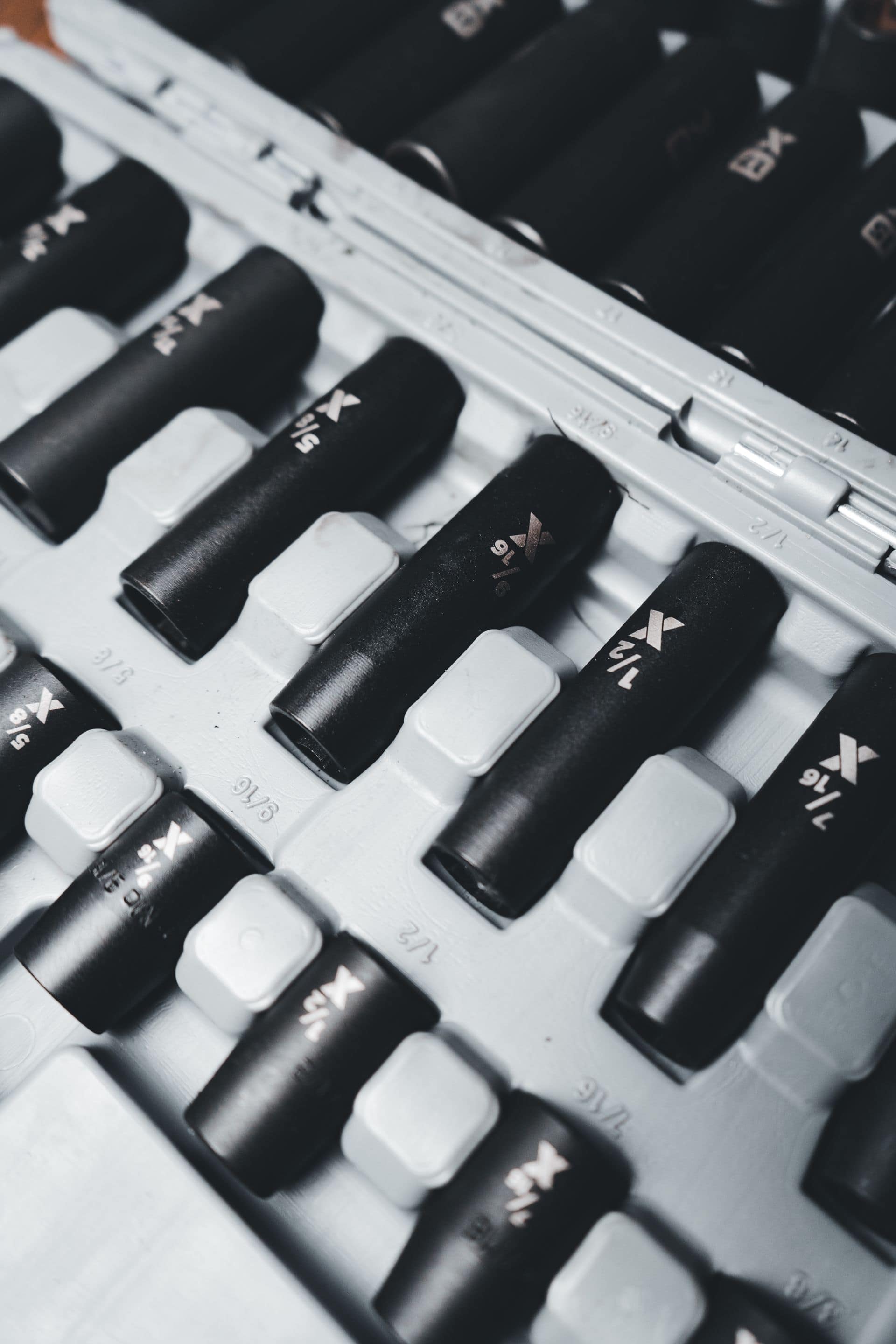 Close-up of a socket set arranged in a workshop tool case